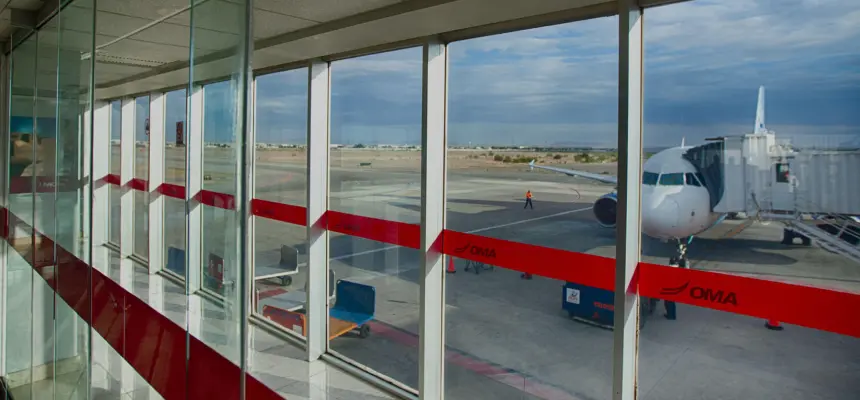 A view of an airliner from the window of an airport gate